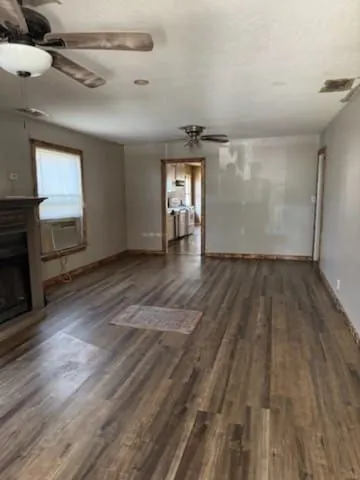 1614 Grandview Ave, Pawhuska, OK. Living area with wood flooring