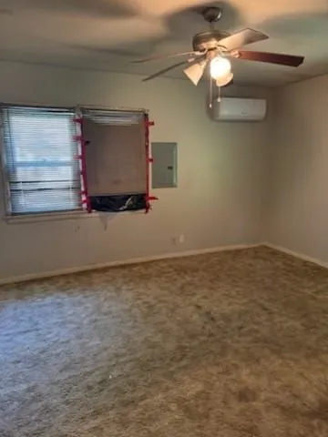 1614 Grandview Ave, Pawhuska, OK. Carpeted room, electrical panel and mini-split